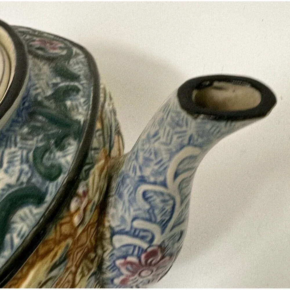 Teapot- vintage ceramic raised Asian  9 inches by 7 Inches